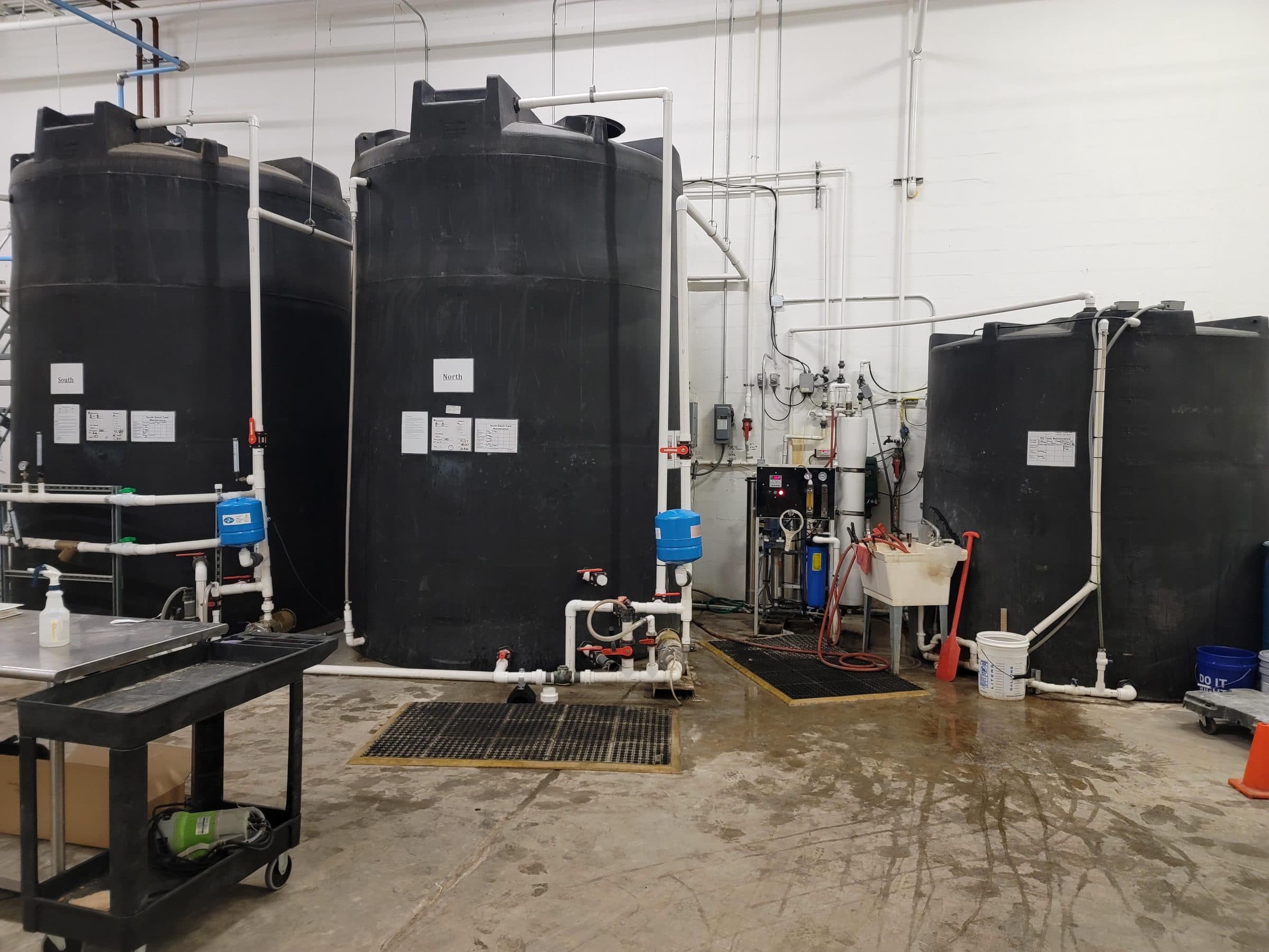 Paired commercial RO storage tanks labeled North and South at a Central Florida facility