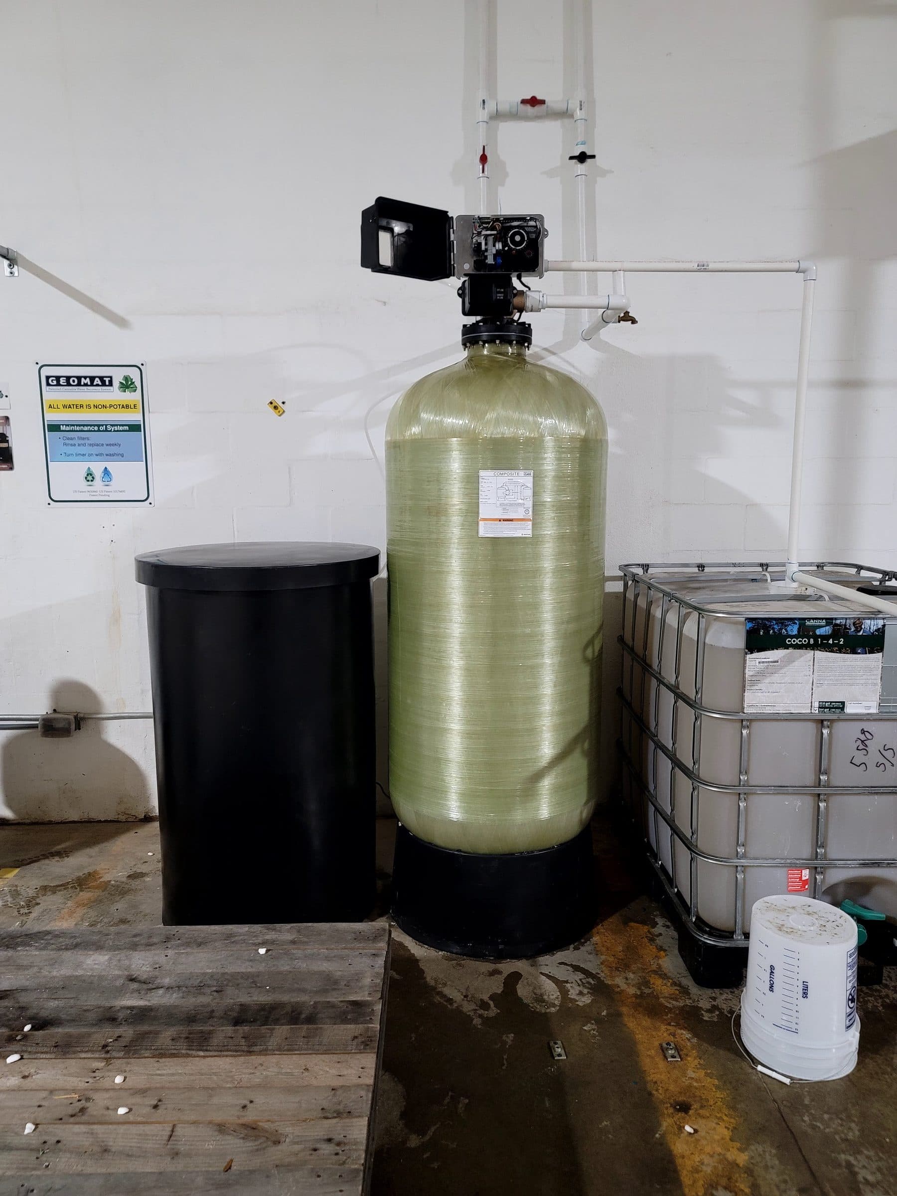 Large mineral tank installed at a commercial warehouse facility