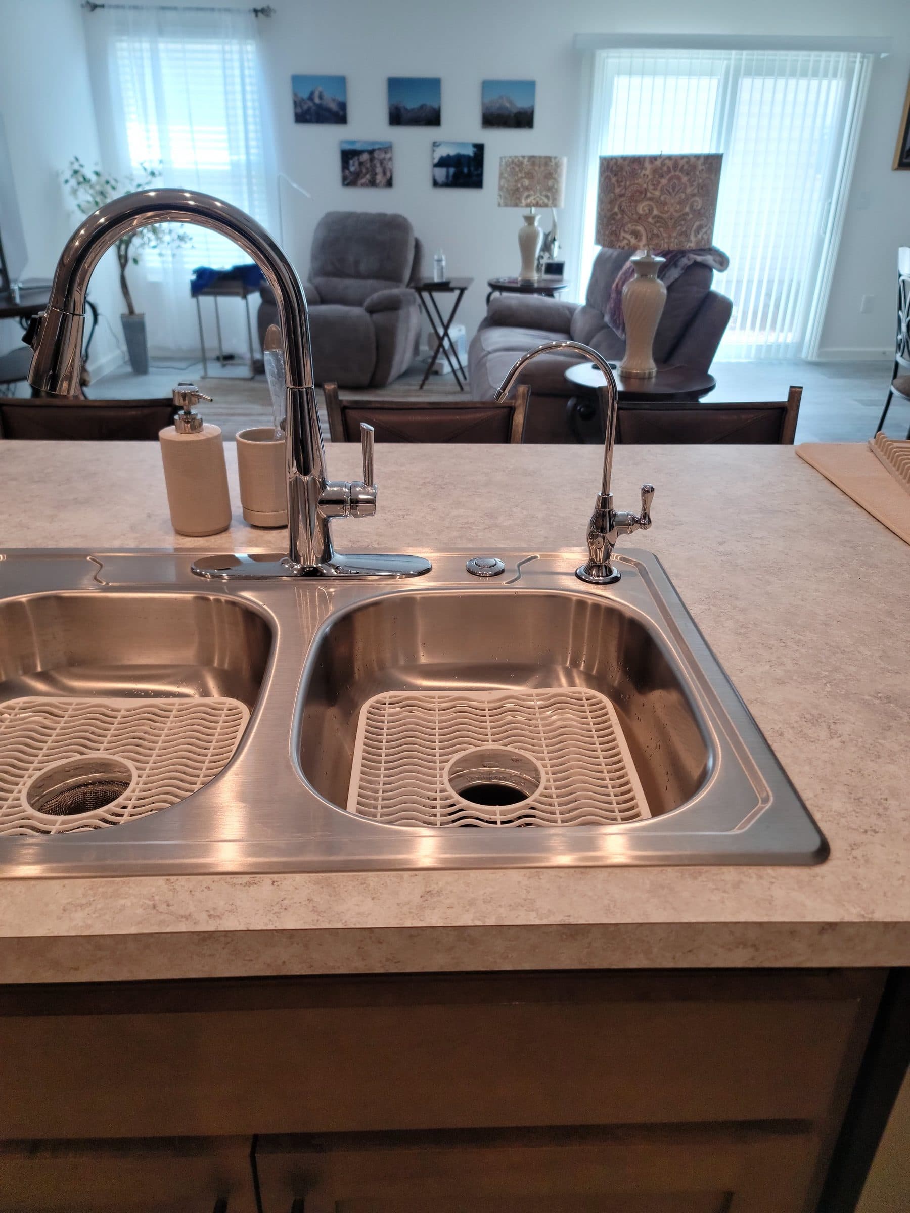 Dual reverse osmosis faucets installed at a kitchen sink