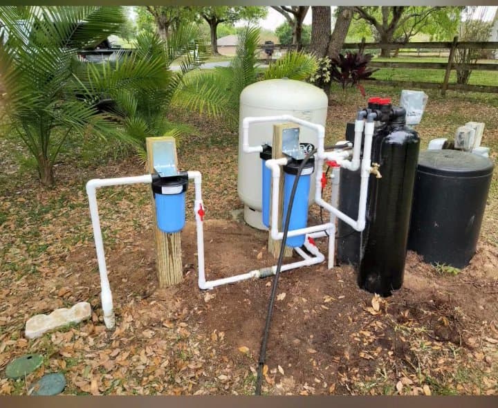 Multi-stage whole-home filtration, softener, and iron tank installed together outdoors