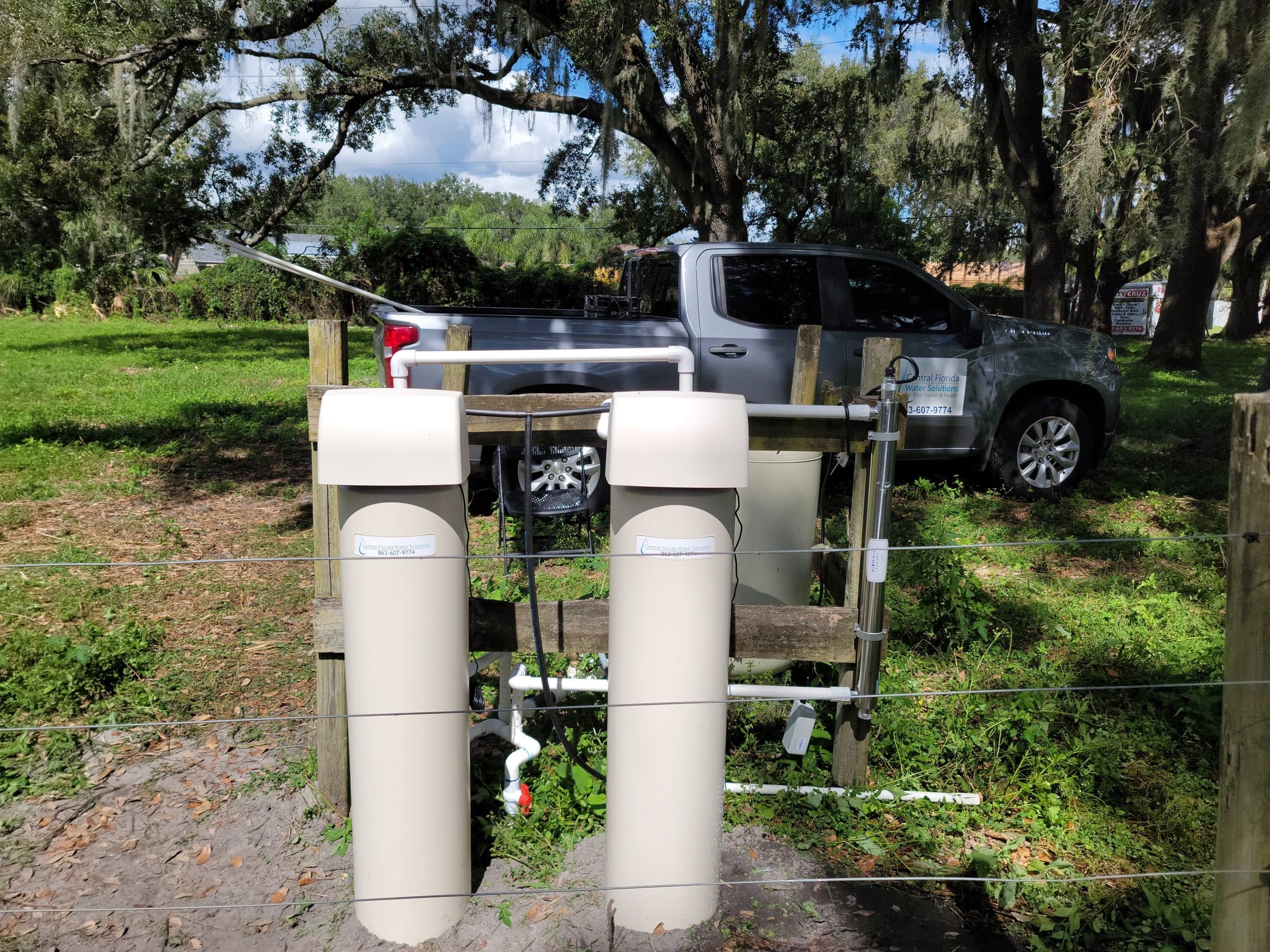 Twin-tank system with UV sterilizer installed beside a driveway